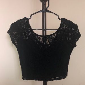 Black lace crop top. NEVER WORN. Size XS. Brand is Material Girl.